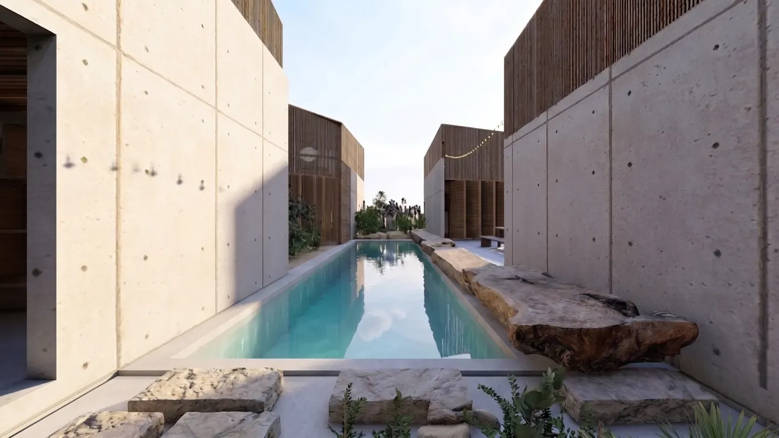 Long pool between concrete pavilions